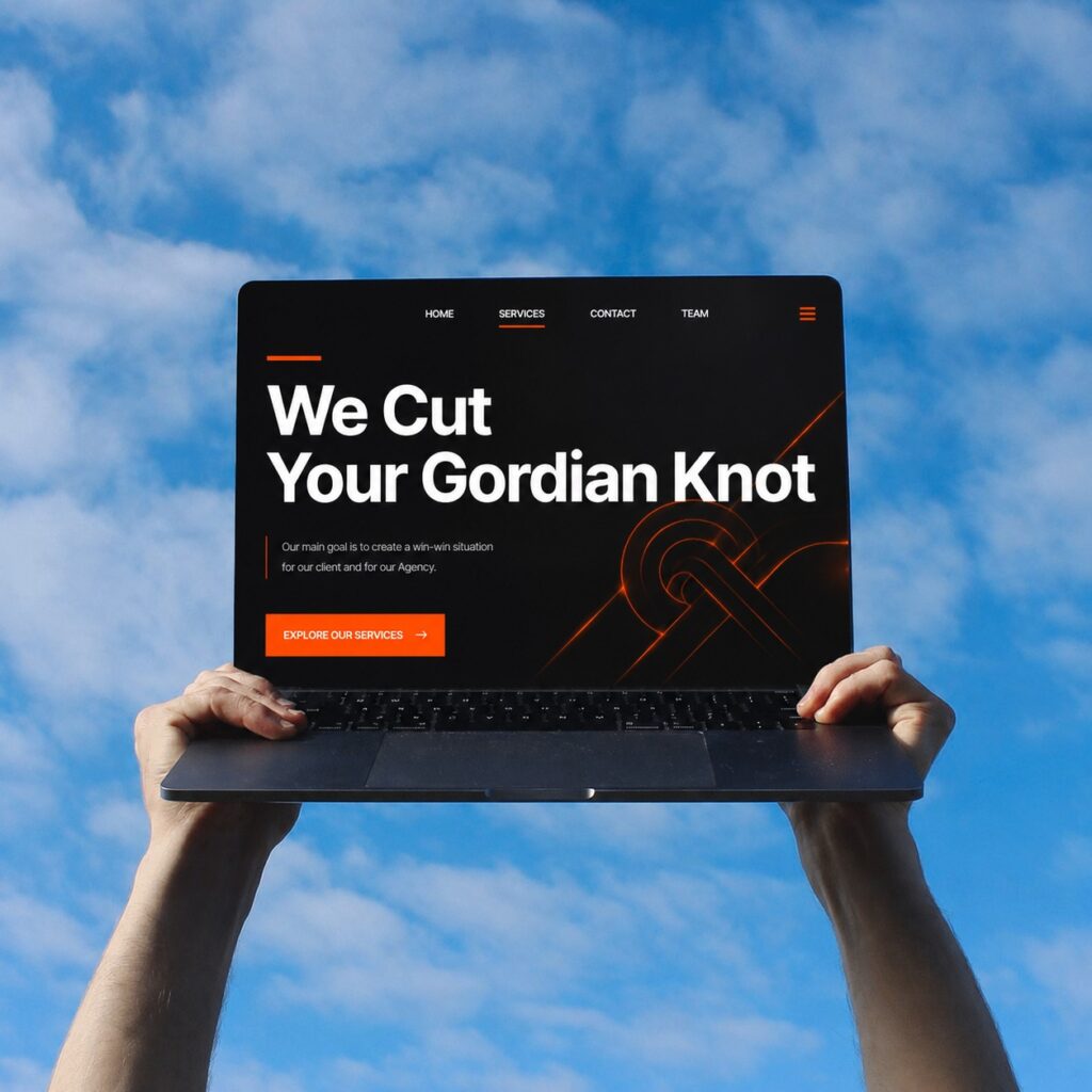 Laptop displaying "We Cut Your Gordian Knot" for digital transformation consulting services